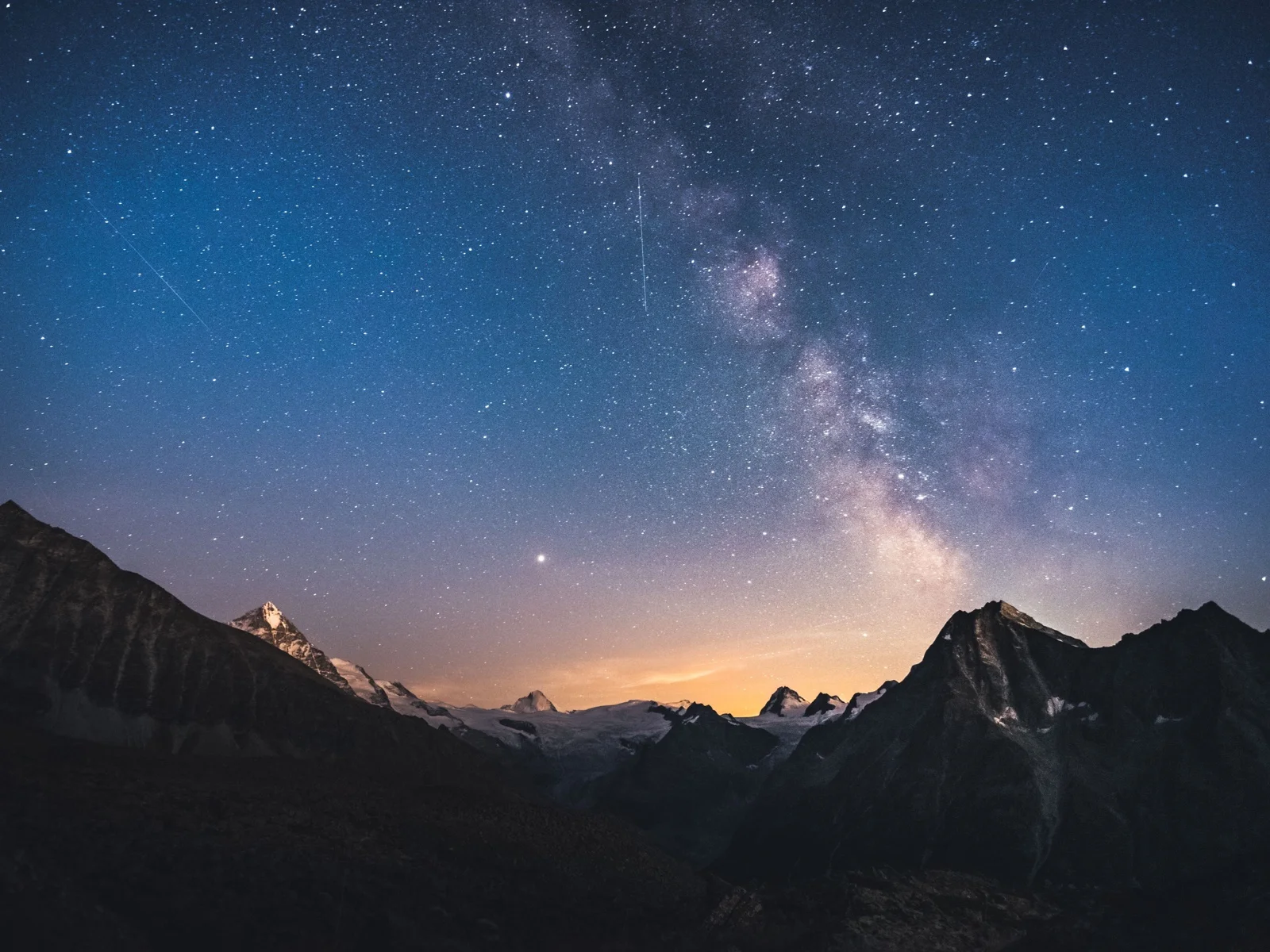 The Milky Way above a dark mountain range