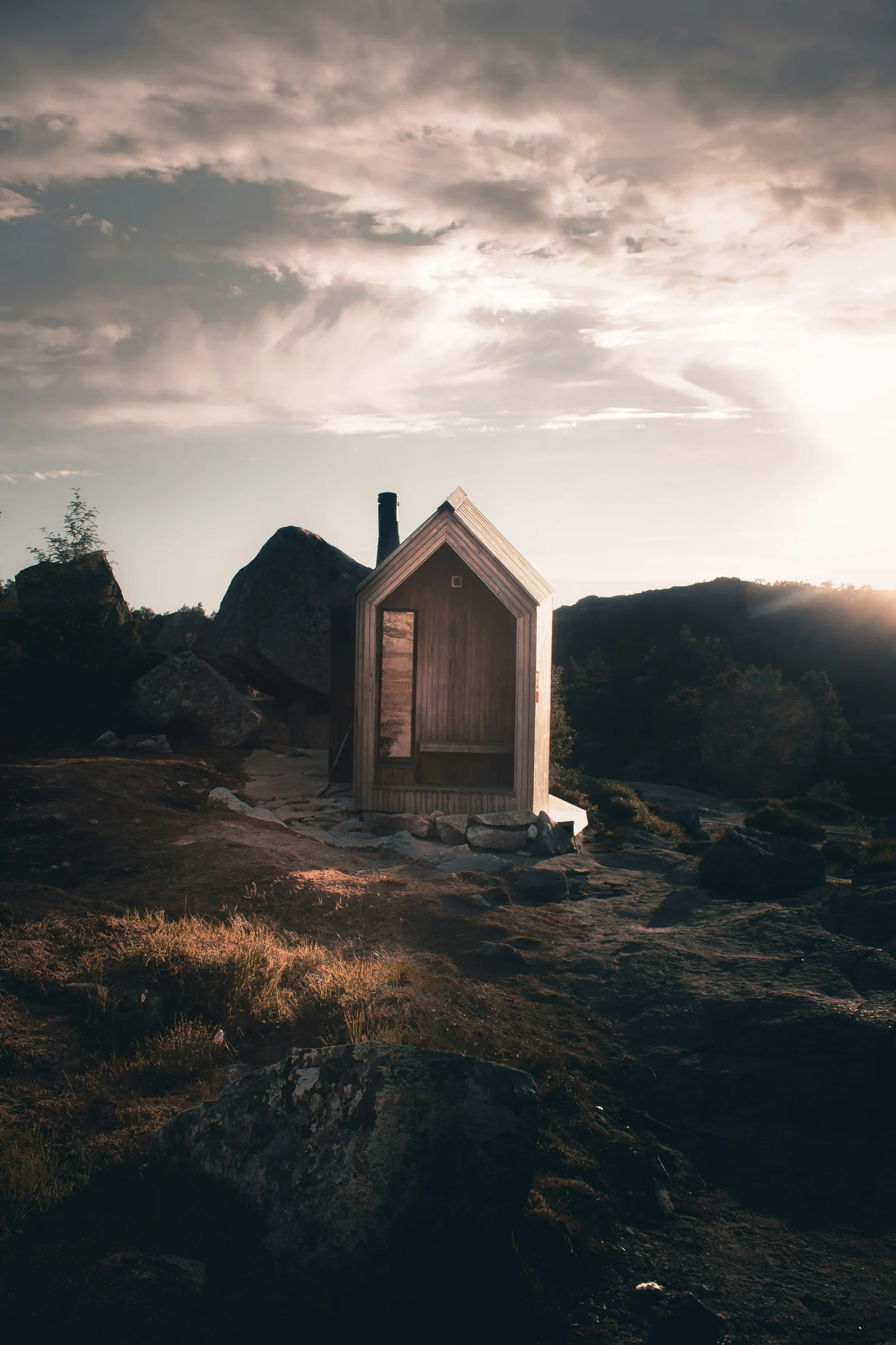 A floating wood-fired sauna beside a tranquil river